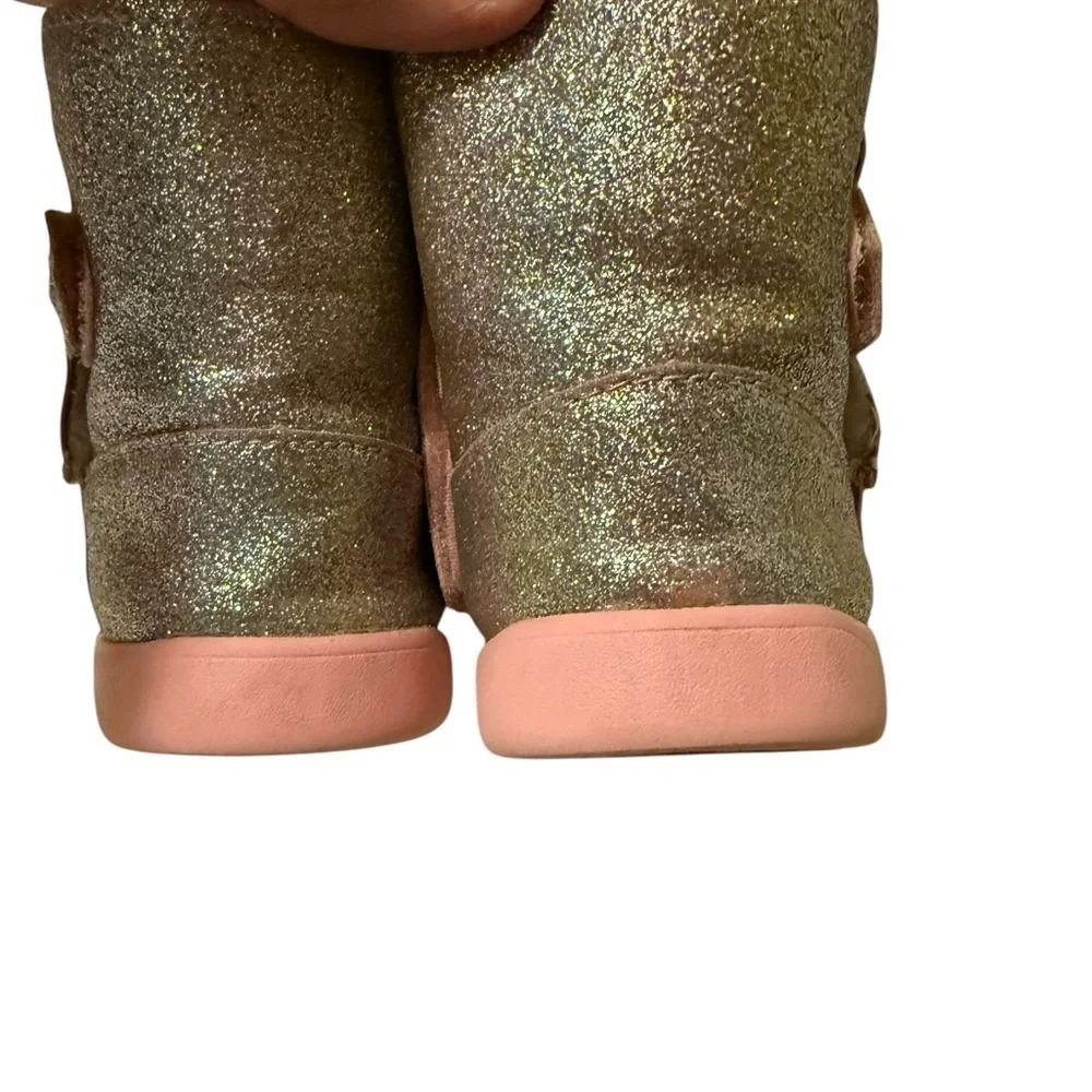 UGG’s Sparkly Gold and Pink Boots.